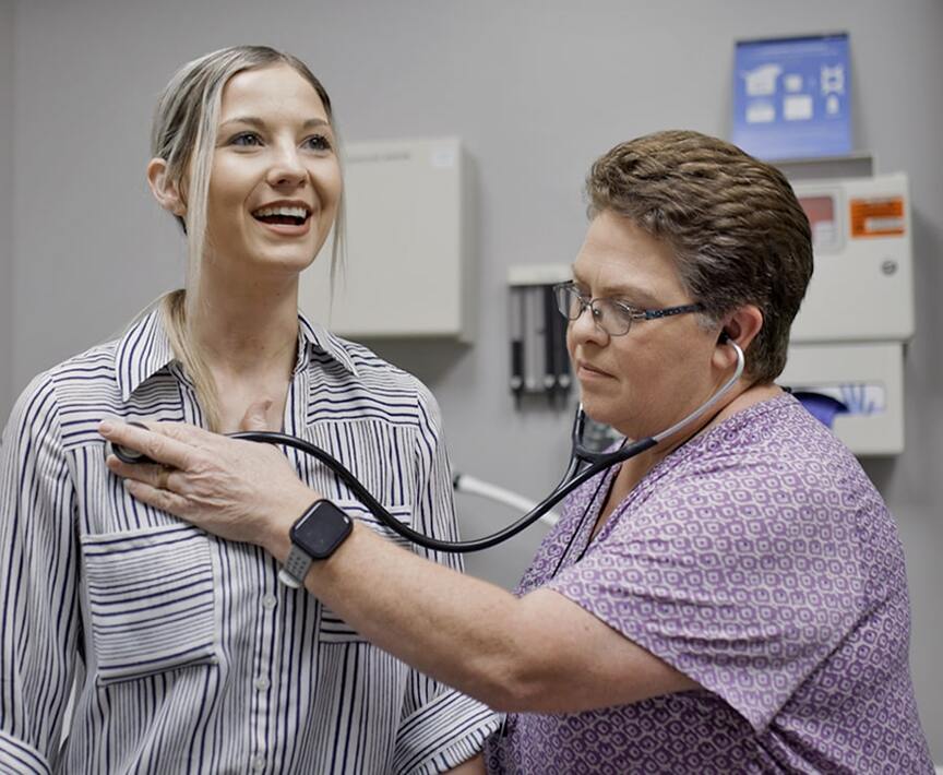 image of doctor checking patient with stethoscope